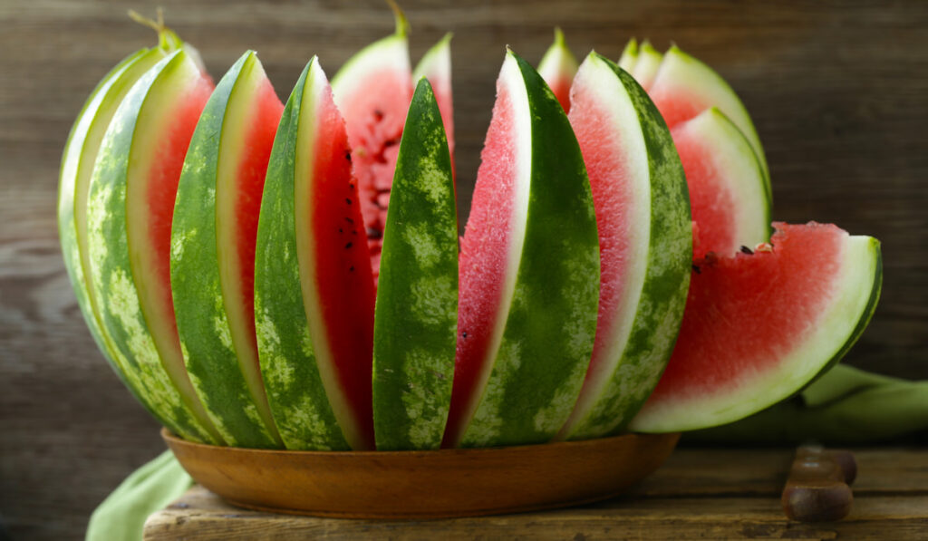 Ripe Sliced watermelon on wooden plate