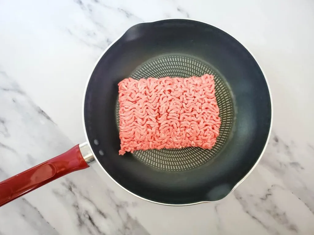 Add the ground beef to a medium pan