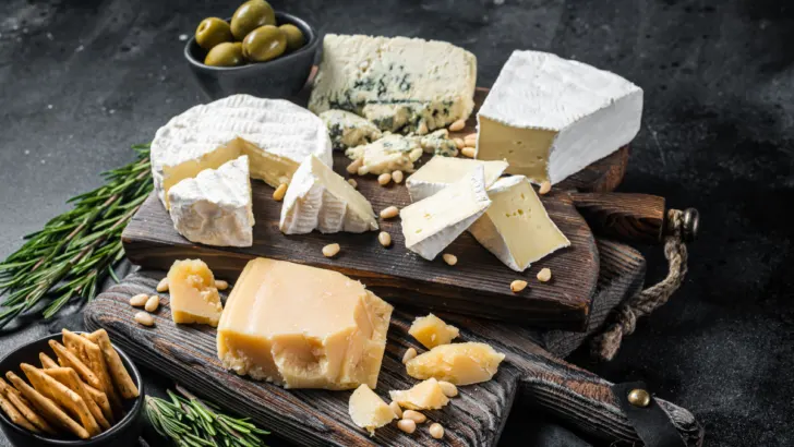 different kinds of cheese on a board