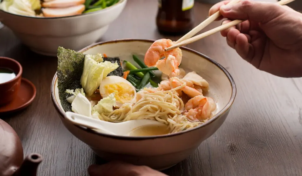 Man eating Asian ramen