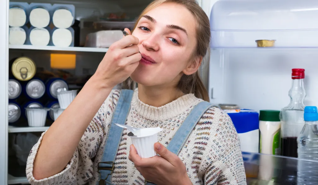 woman eating sour cream