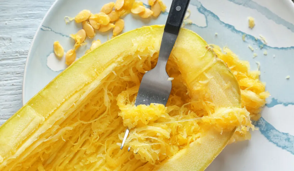 Fork with spaghetti squash on plate