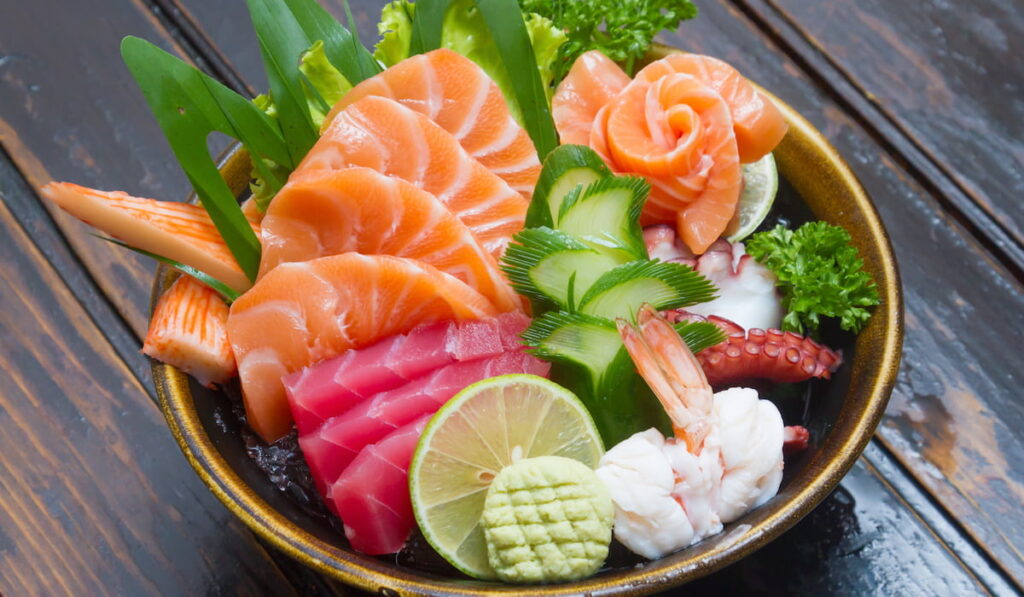 Sashimi (japanese food). Sliced raw seafood in a bowl