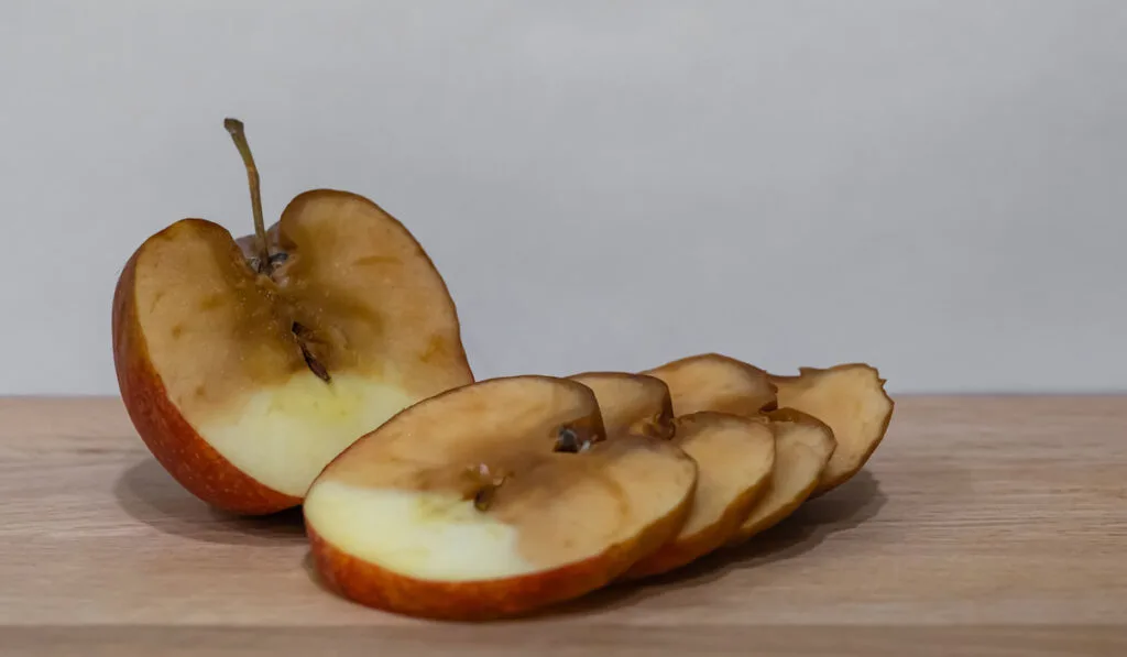 Slices of rotten apple on the table