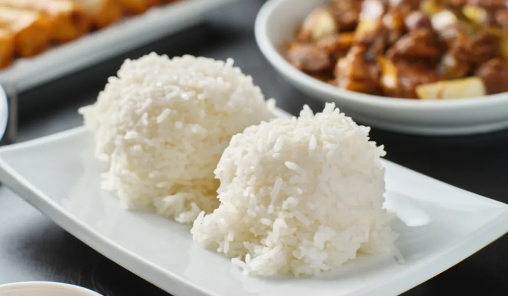 two scoops of cooked white rice 