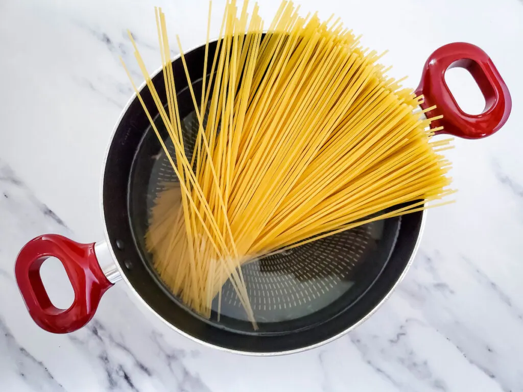 cooking pasta noodles in a pot