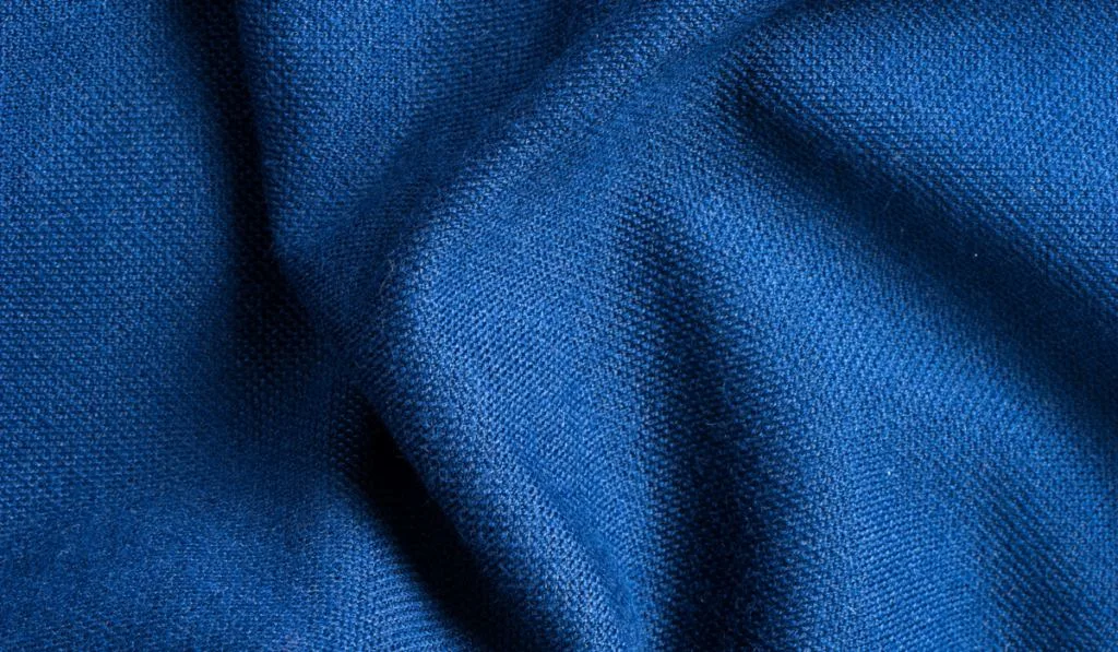 Texture and background of blue polyester fabric.
