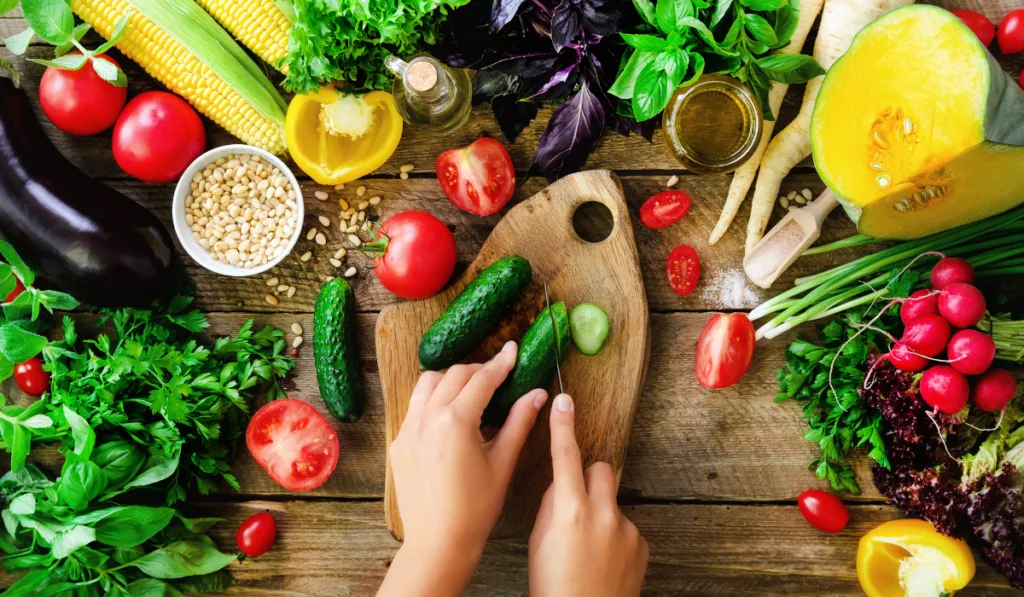 Woman hands cutting vegetables