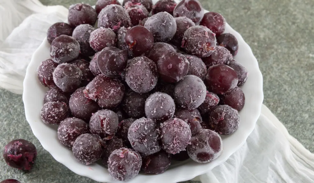 Frozen grapes served in a white bowl