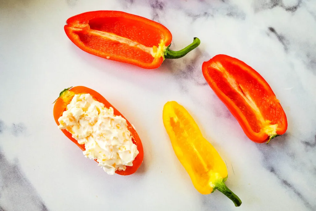 Stuffing bell peppers with cheese mixture