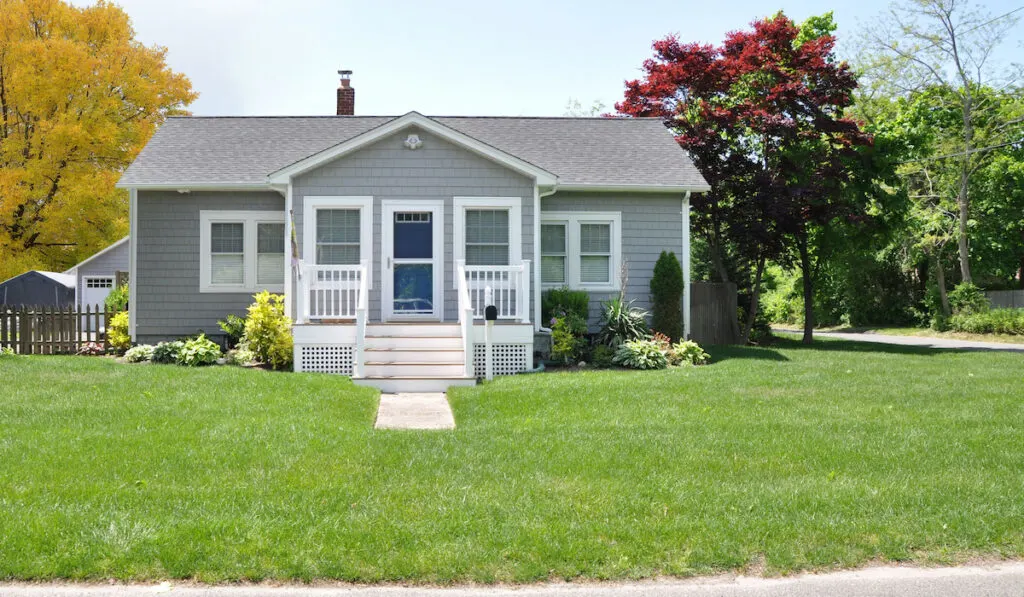 Suburban Gray Bungalow style home Autumn Season USA
