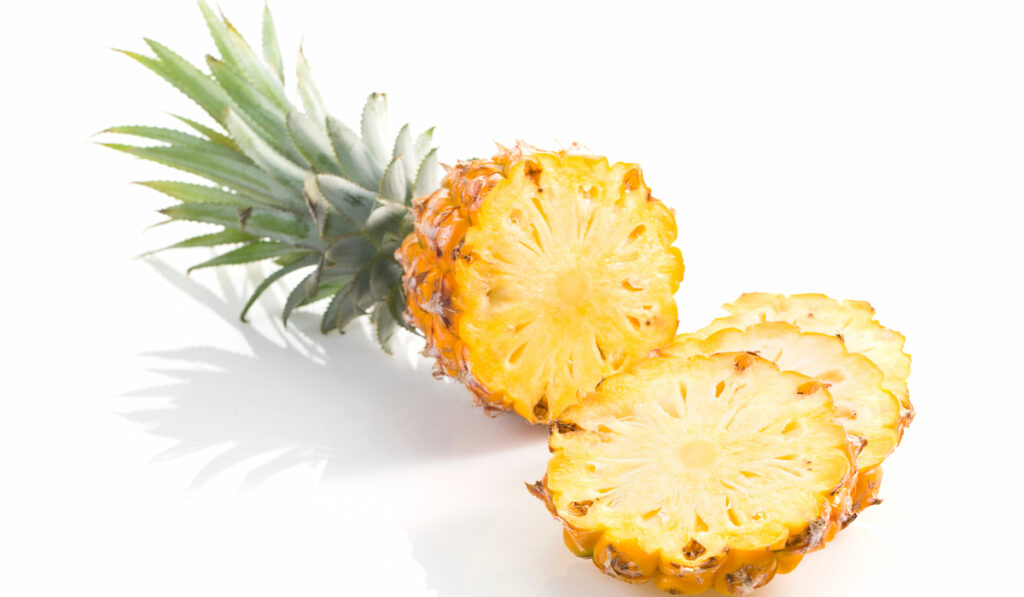 Sliced pineapple on white background