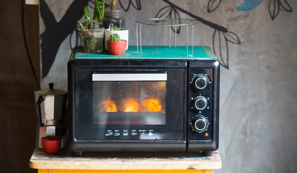 Vintage old oven on a small table
