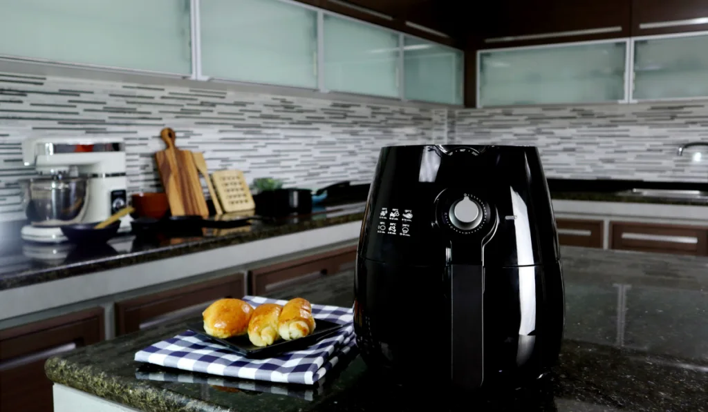 air fryer appliance, and a dish of homemade butter suger breads