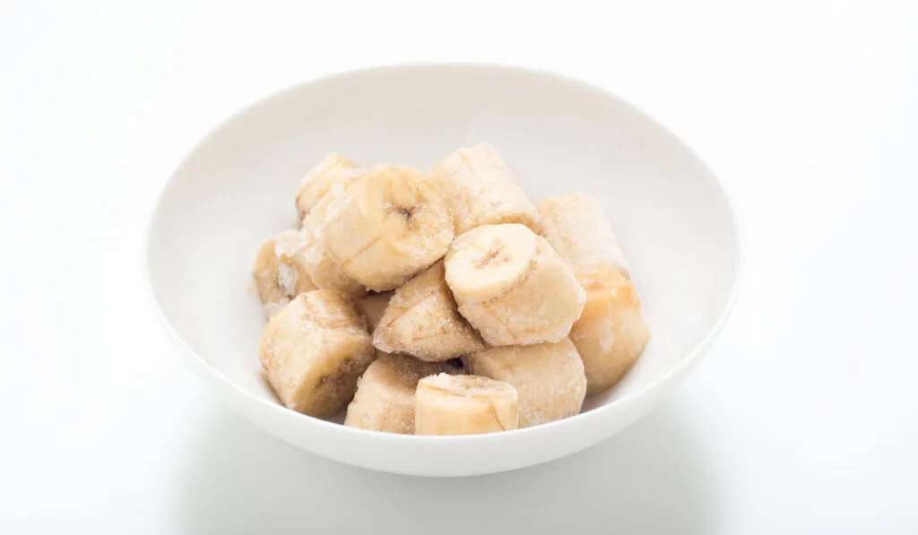 slices of frozen banana in white bowl