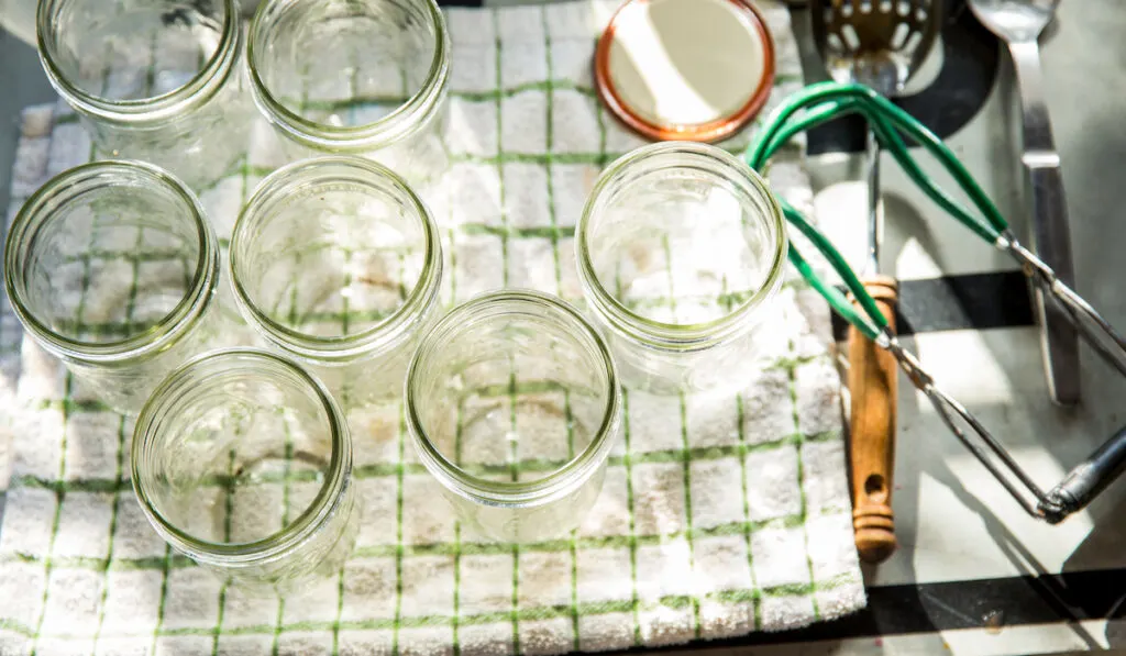 sterilized preserves jars on tea towel
