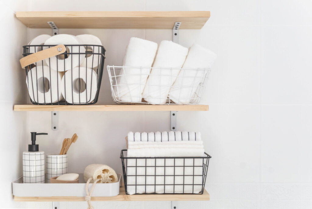 stock of tissues and towels on a wall mounted shelf 