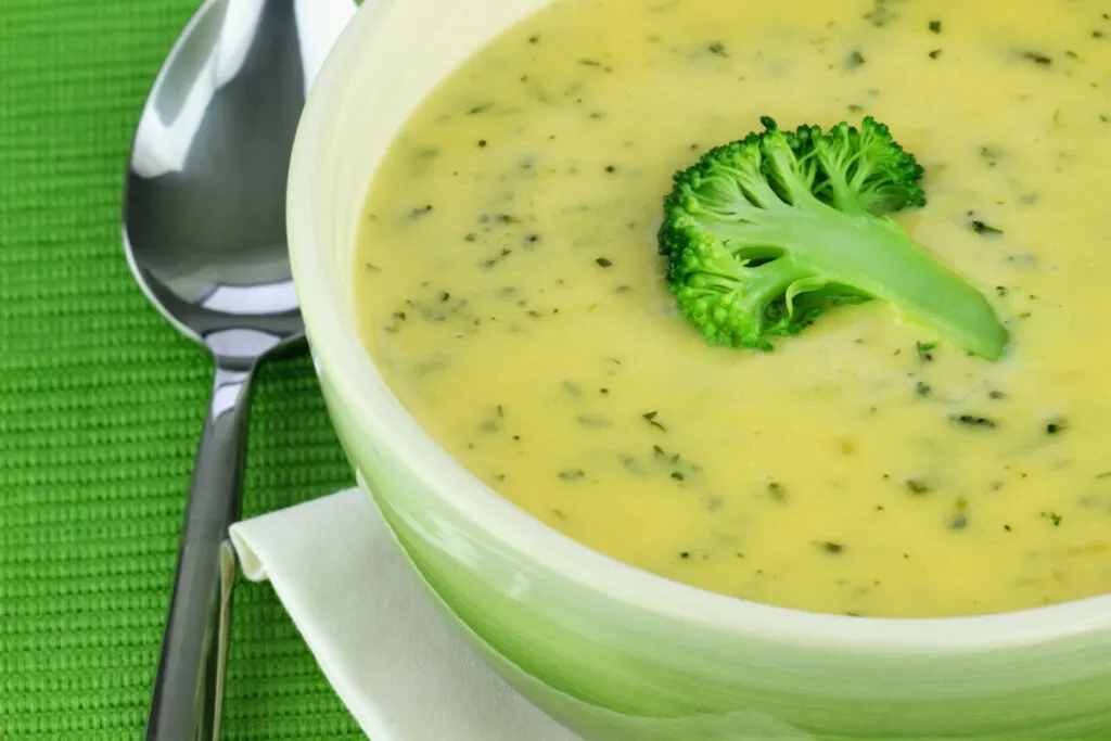Broccoli-Spinach Soup with Crispy Broccoli Floret in a bowl 