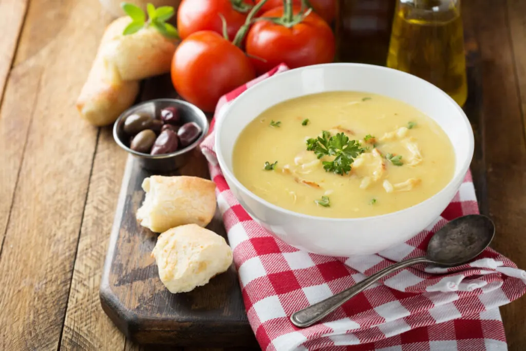 Creamy Chicken Soup in a soup bowl with 2 pieces of bread at the side