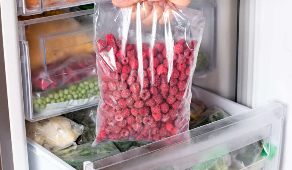 Frozen raspberries in the freezer
