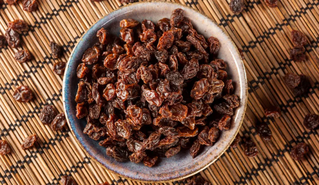 organic dried raw raisins in a bowl
