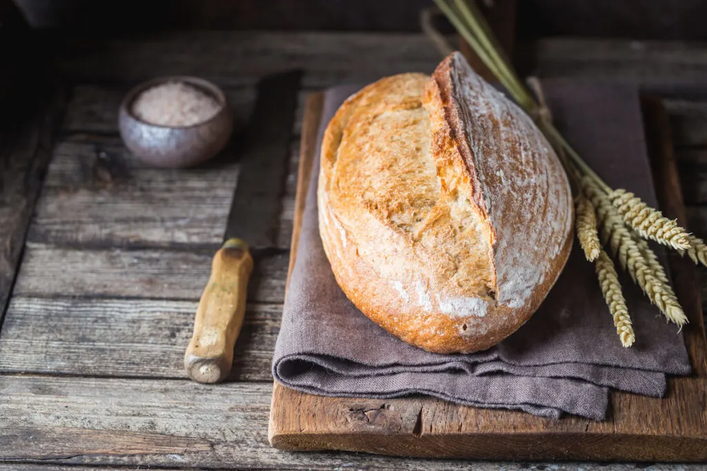 freshly baked bread waiting to cool before slicing 